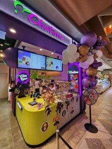 Inside the Chatime Bankstown store showing staff preparing drinks behind a bright counter decorated for the reopening