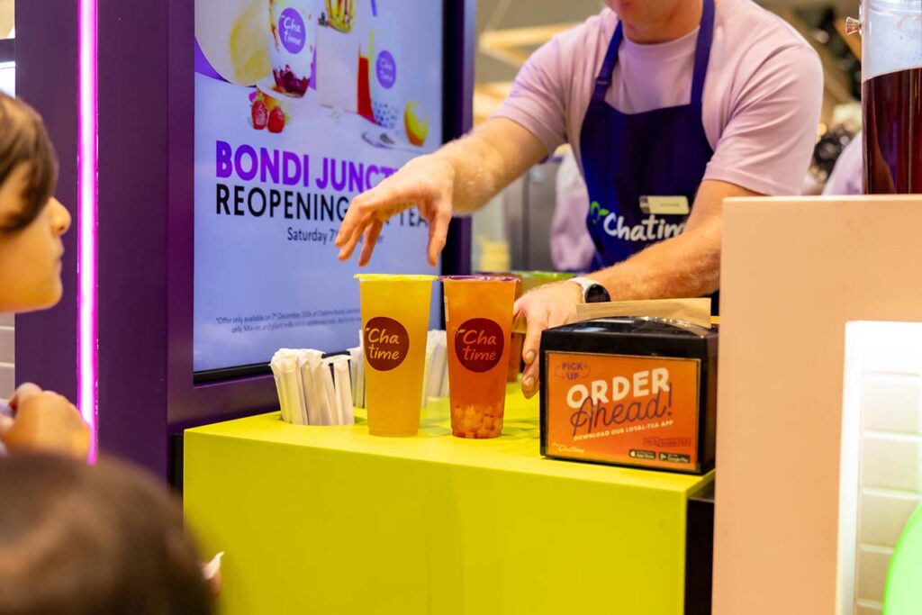 Chatime team member preparing fresh bubble tea drinks during a Bondi Junction store reopening