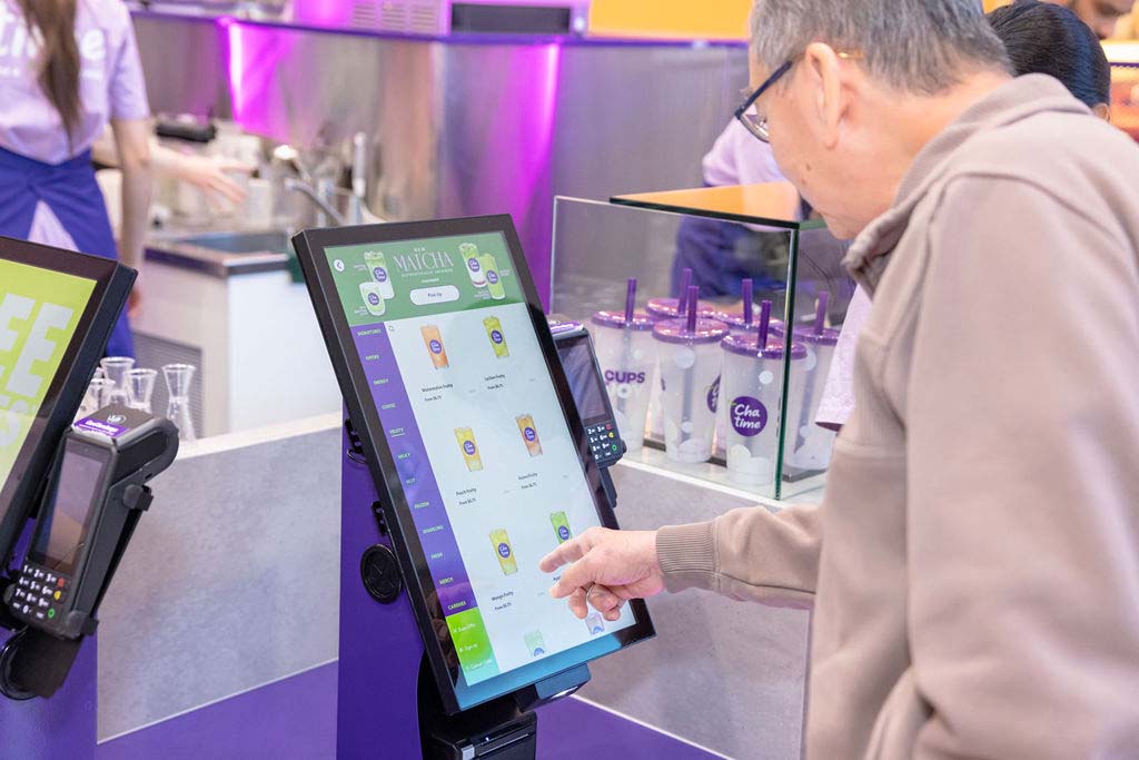 Digital ordering experience inside a Chatime store Customer using a digital ordering screen at a Chatime bubble tea store in Australia