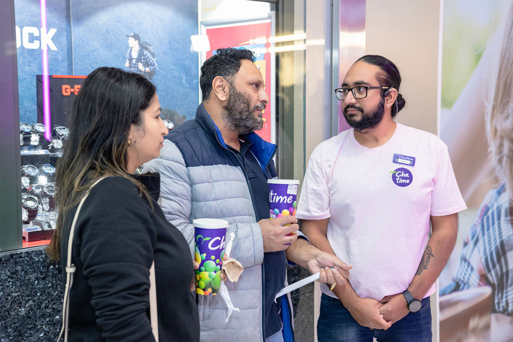 Chatime franchise team member speaking with customers at an Australian store