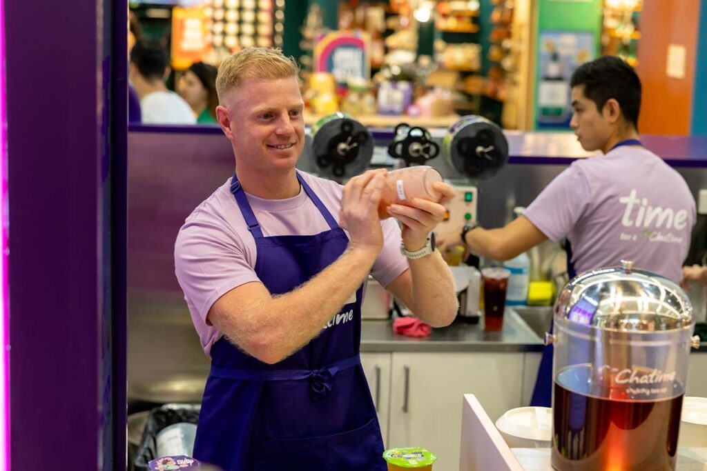 Chatime franchise Australia team member preparing bubble tea in store